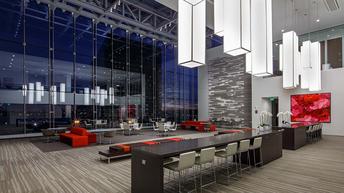 Spacious lobby with glass front and recreation room for employees and clients at 101 Seaport Boulevard in Boston.